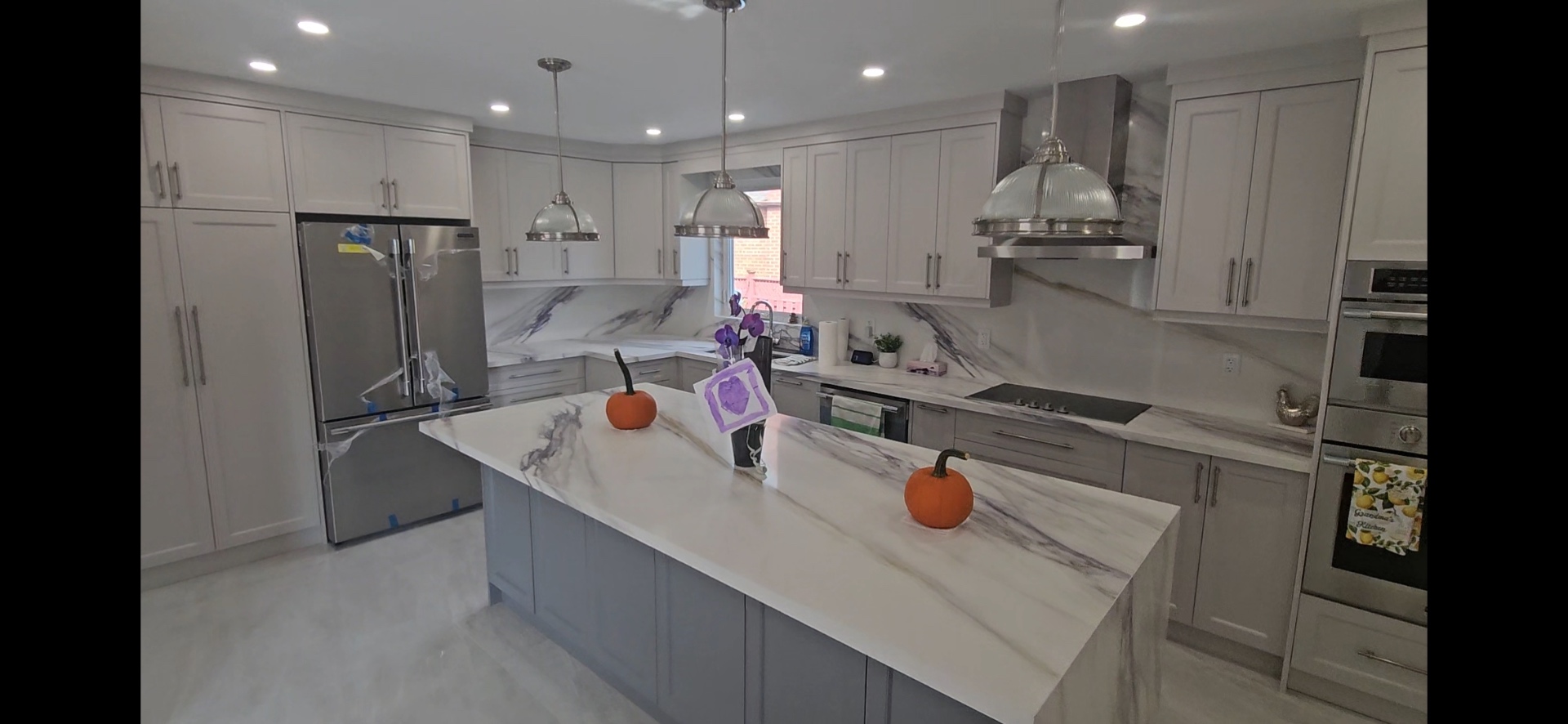 Modern marble kitchen renovation by Ultimate Finish Contracting